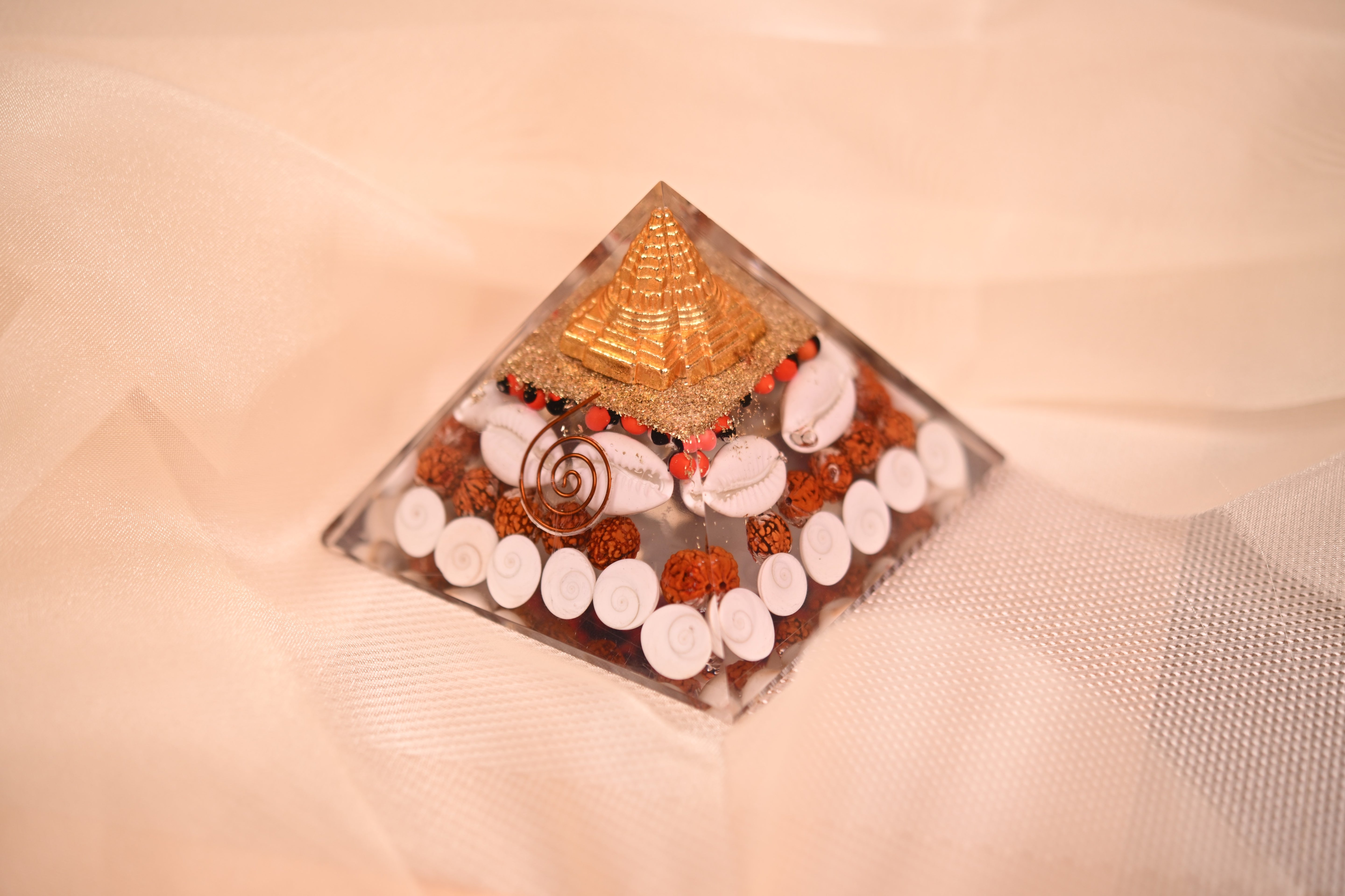Handcrafted Orgonite Pyramid with Rudraksha, Cowrie Shells & Golden Pyramid