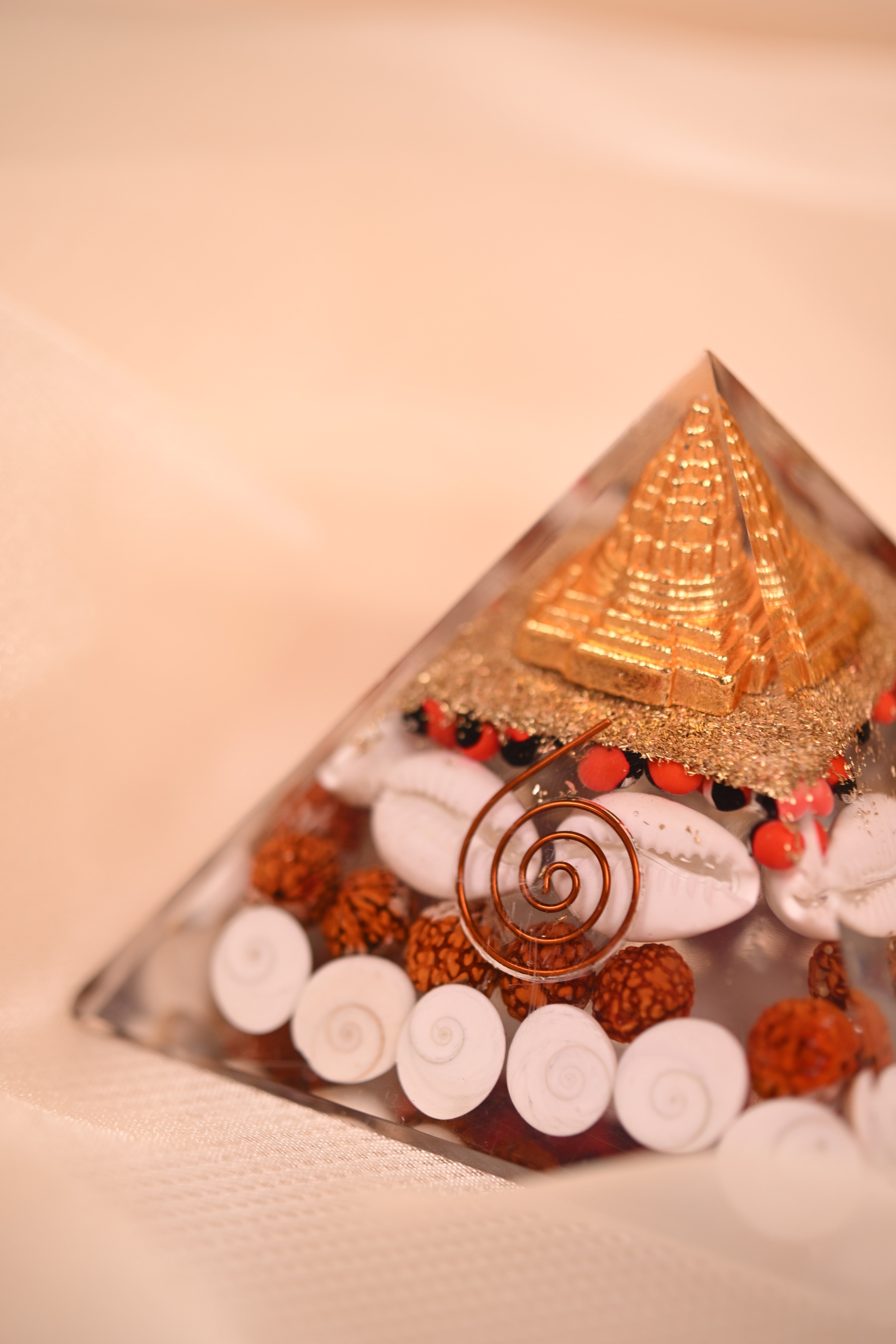 Handcrafted Orgonite Pyramid with Rudraksha, Cowrie Shells & Golden Pyramid