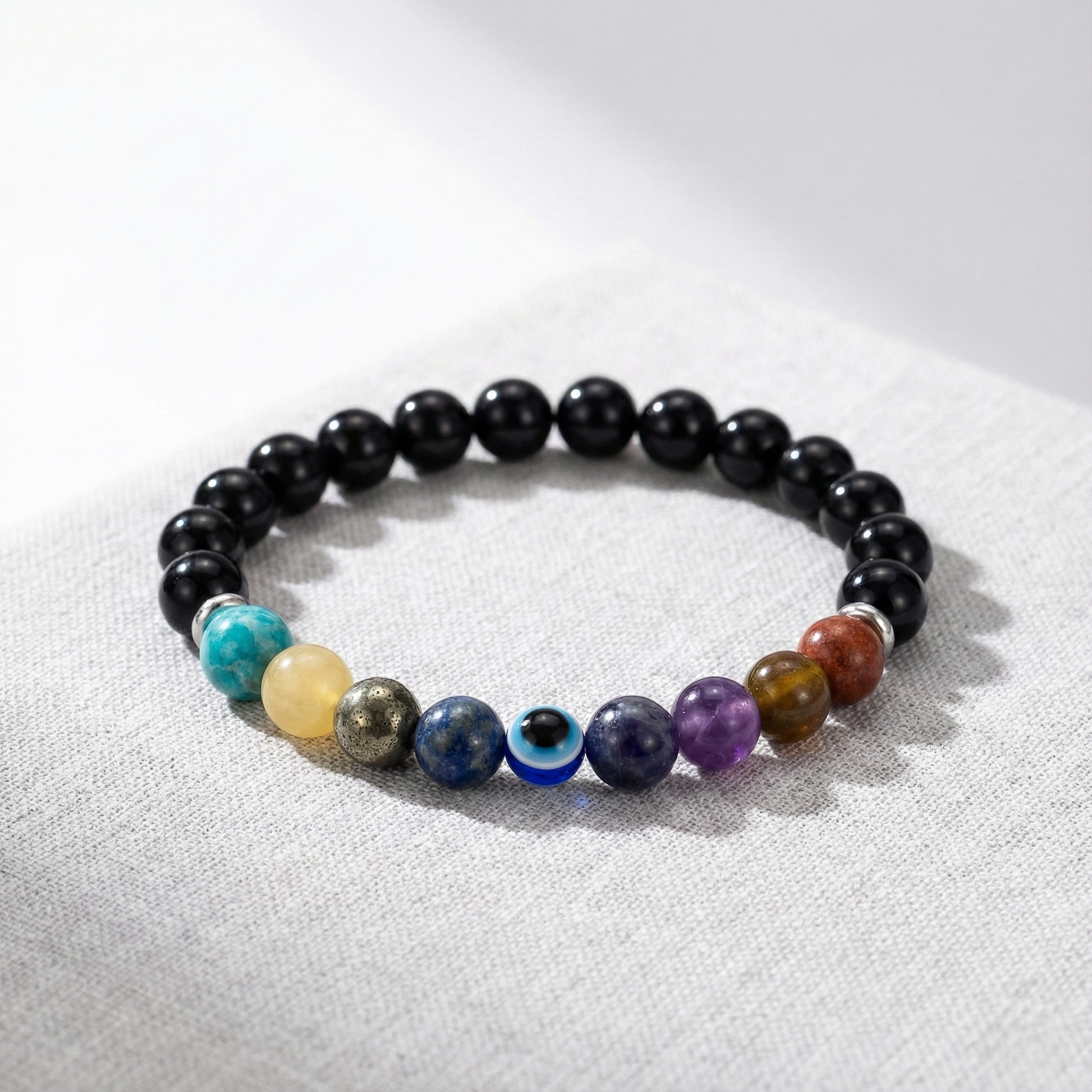 Bracelet activation ritual with sage, candle and moonstones