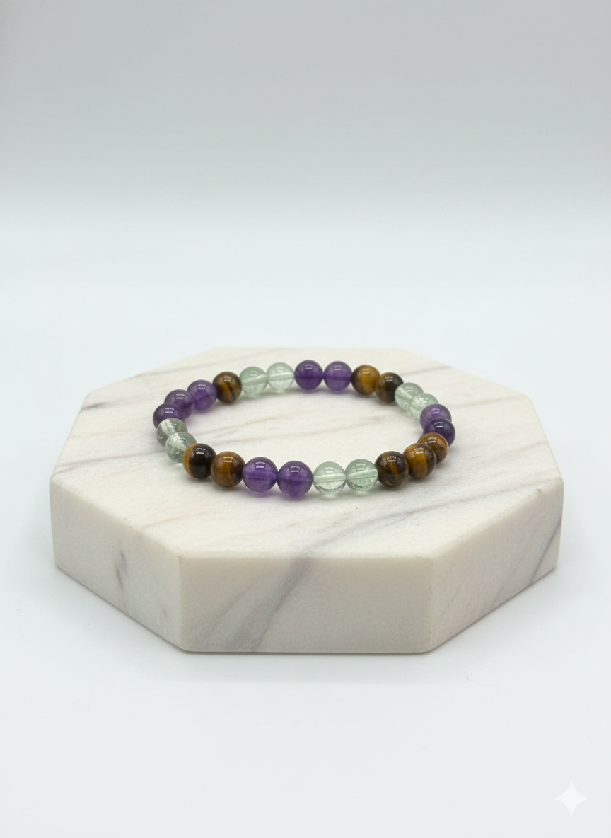 Bracelet activation ritual with sage, candle and moonstones